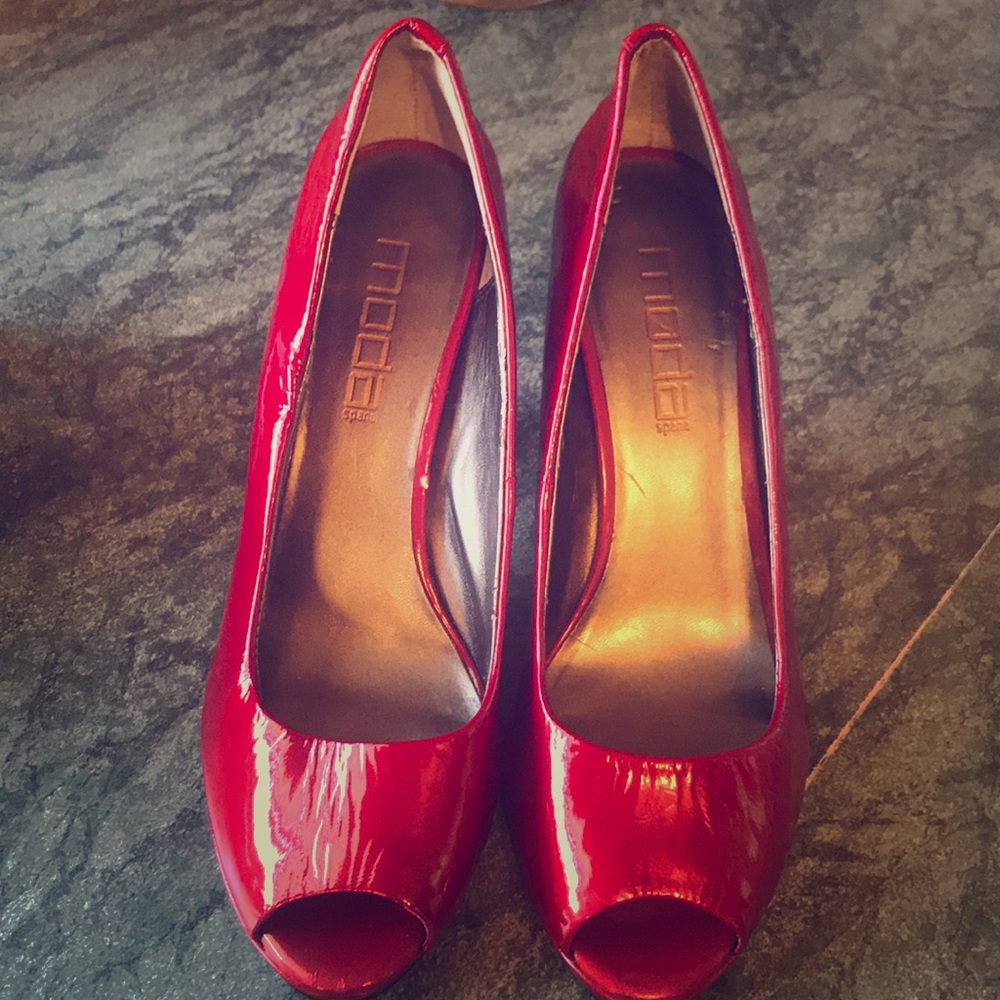 Peep toe red pumps